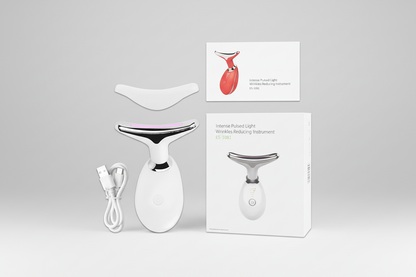 White skincare device with packaging and accessories on a white background